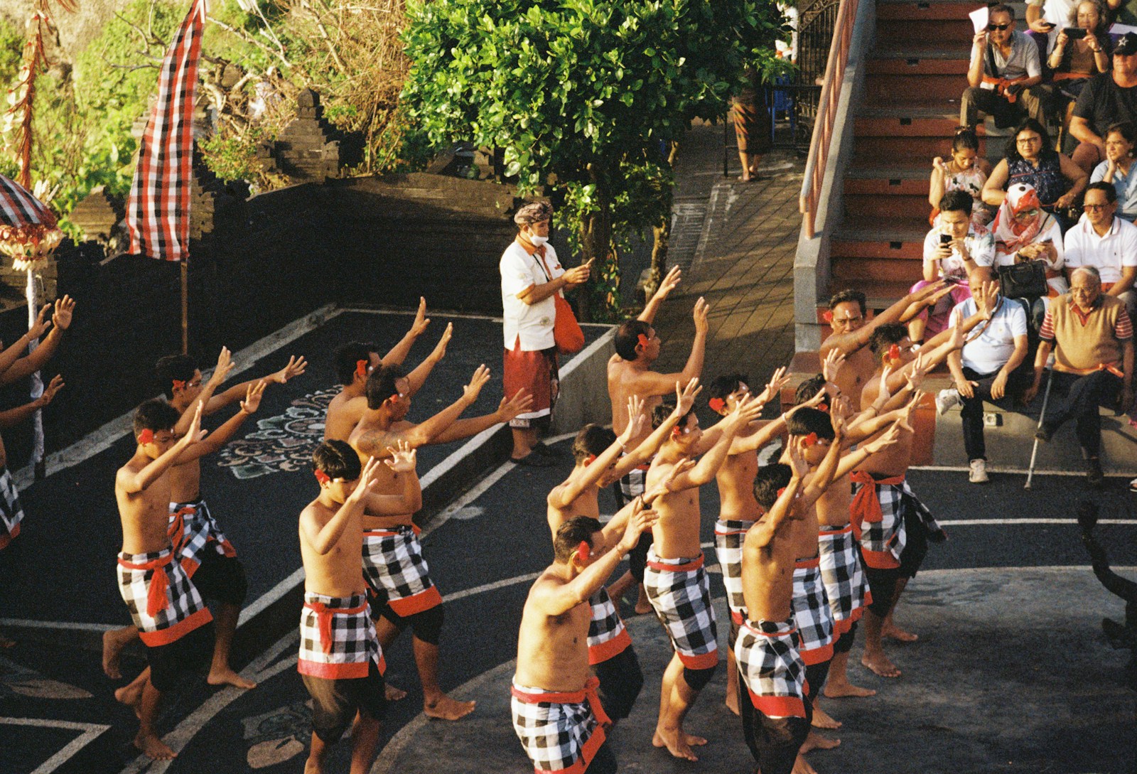 a group of men dancing in front of a crowd